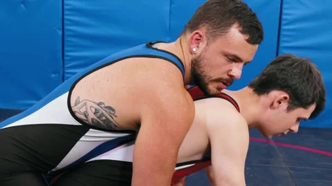Varsity Grip: Joel Someone together with Eric Fuller wrestling